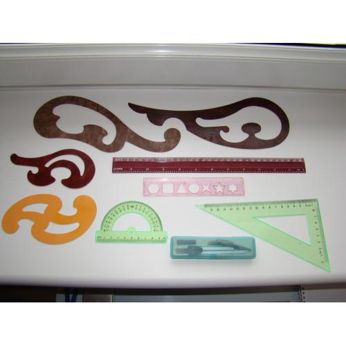 Лекала,  треугольник, линейка, транспортир и циркуль.