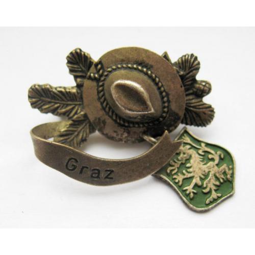 Graz - Грац = мисливство - туризм = знак на альпійський капелюх = важкий метал 