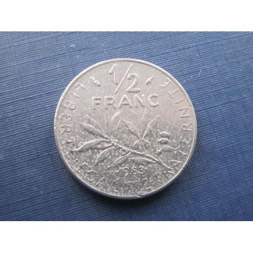Монета 1/2 пол франка Франция 1983