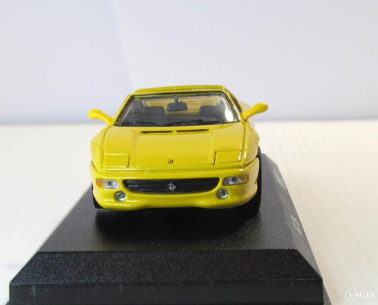A collectible scale model Ferrari F355 GTS from Minichamps F1