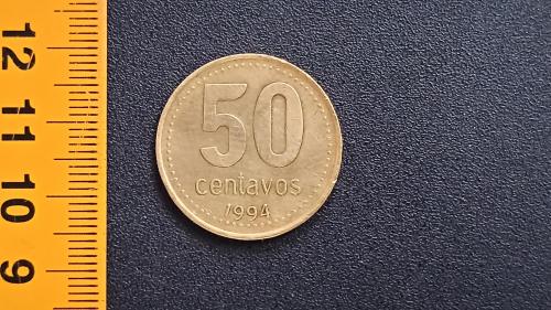 ​Аргентина 50 сентаво 1994 рік. Алюміній-Бронза, 5.8g, ø 25.2mm