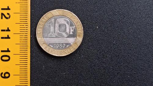 ​Франція 10 франків 1989 рік. Бі-Метал: центр - Нікель, кільце - Алюміній-Бронза, 6.5g, ø 22.3mm