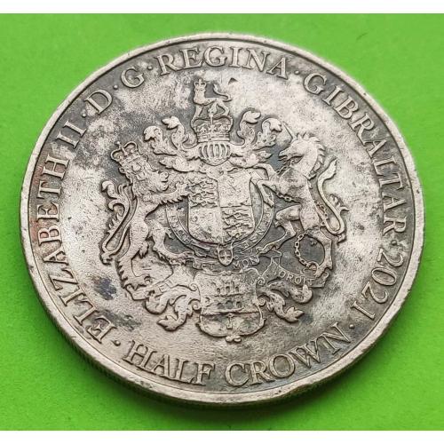 Гибралтар - какая-то заготовка под монету 1/2 кроны 2021 г. (гурт рубчатый)