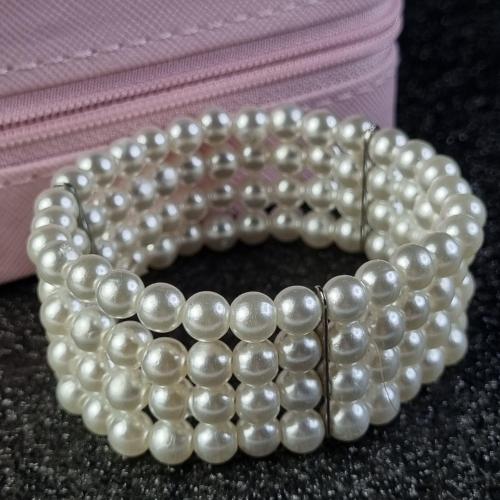 Перлова браслетка з чотирма рядами — елегантна класика